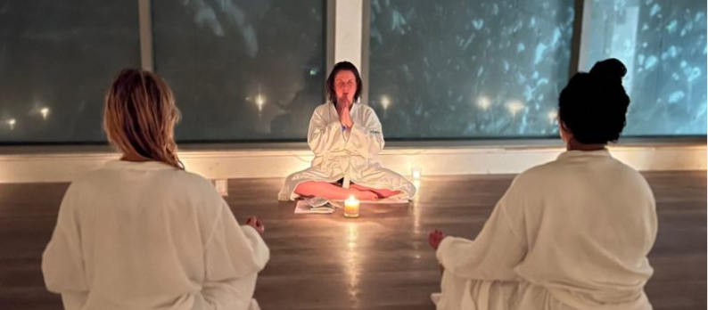 Three ladies meditating at Vetta Nordic Spa
