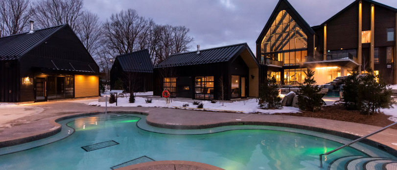 An outdoor view of the Vetta Nordic Spa at night