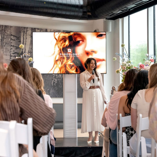 A lady speaking at an event at Vetta Nordic Spa