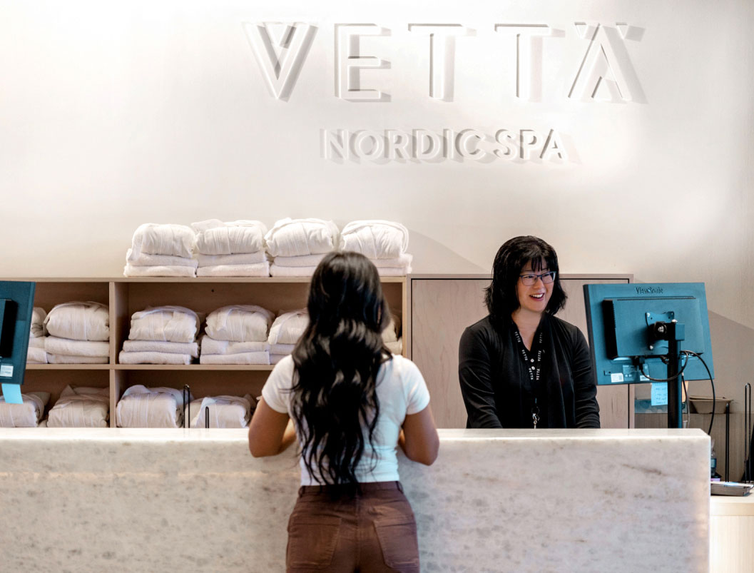 Receptionist helping a customer at Vetta Nordic Spa